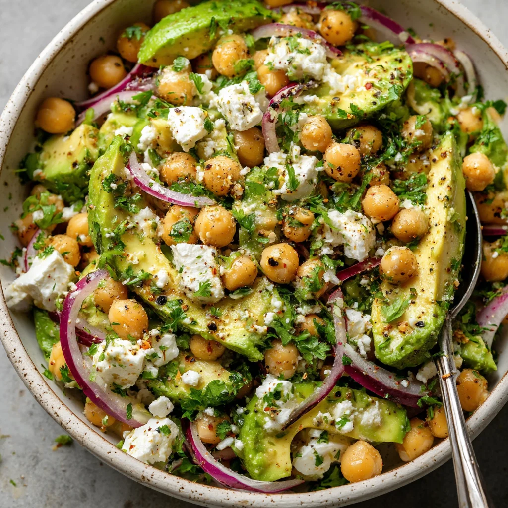 Close-up of a colorful chickpea feta avocado salad. Close-up of a colorful chickpea feta avocado salad.