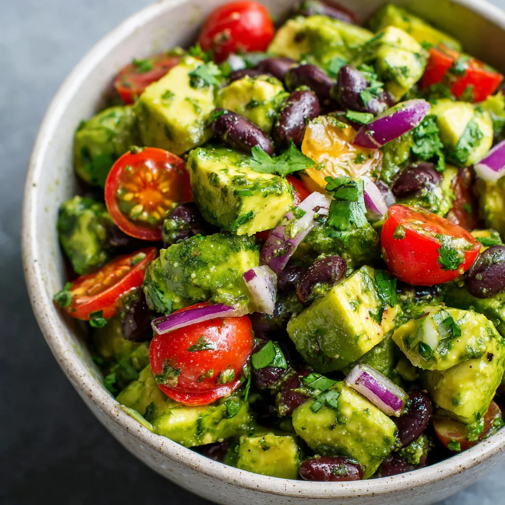 Vibrant avocado black bean salad in a bowl. Vibrant avocado black bean salad in a bowl.